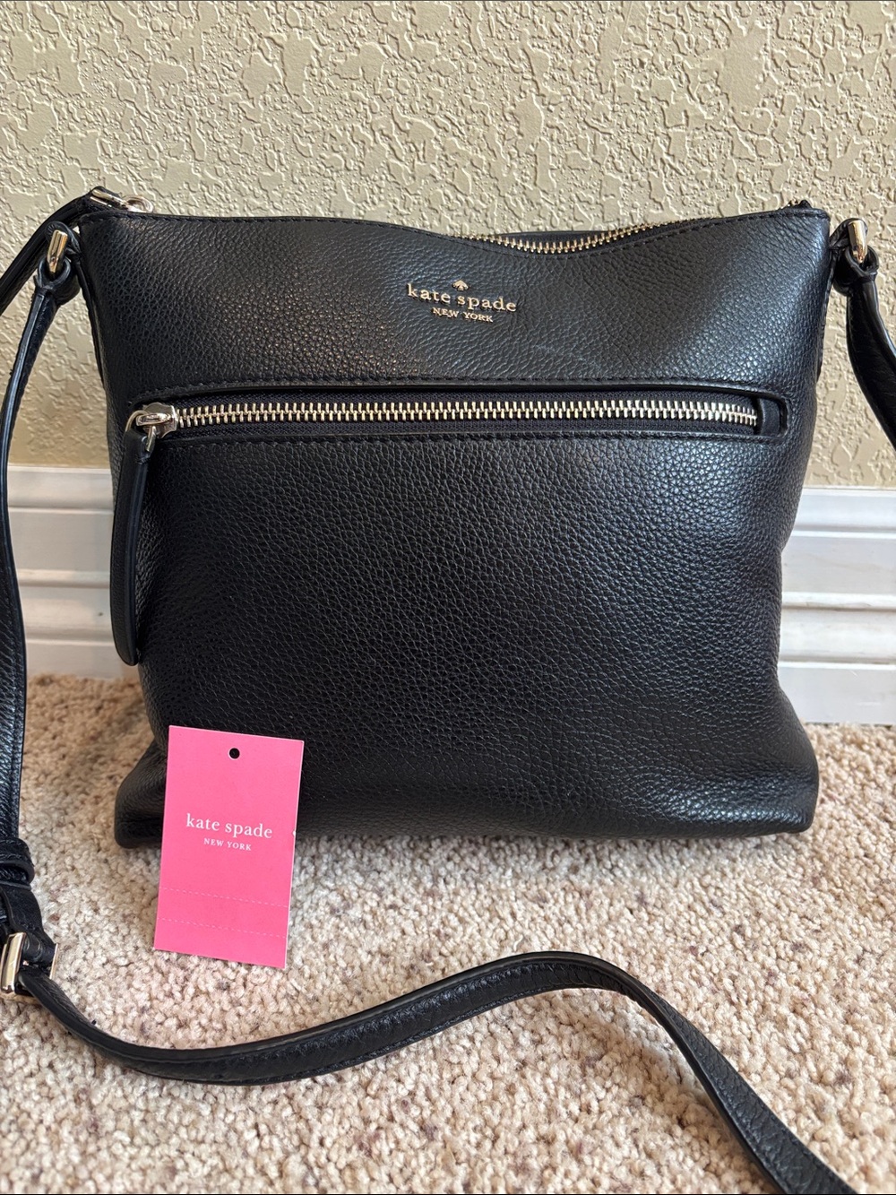 kate spade Black Pebbled Leather Crossbody with Front Zip Pocket.